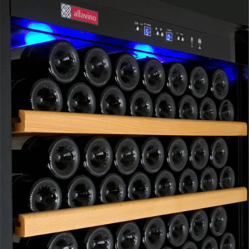 Luxury black single zone wine refrigerator by Allavino, featuring a UV-resistant glass door, wood-accented shelving, and elegant LED lighting in a high-end interior setting.