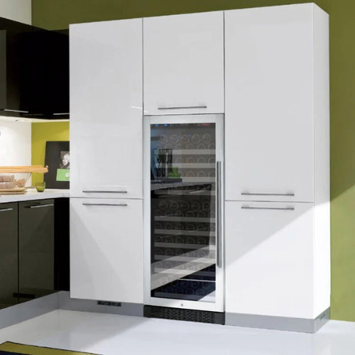 Stainless steel single zone wine refrigerator by Allavino featuring UV-protected glass, soft blue lighting, and sleek wood-accented shelving in a modern build.


